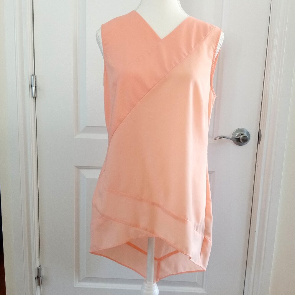 Chic Peach asymmetrical sleeveless blouse